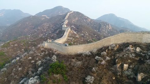 Aerial view of Great Wall of China during cold morning foggy day. Famous landmark Great Wall and mountains located in Badaling next to Beijing.