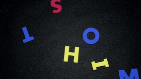 show time conceptual word, colorful alphabets moving on black background