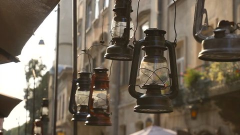 Vintage Lamps, Kerosene Lamps, Metal and Glass Lamps, Hanging at the Street, Decor, Decoration, old multi-storeyed houses on background