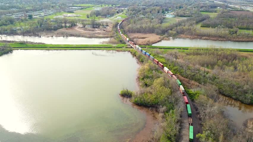 Skyview over top a cargo train leaving ST. Louis Missouri crossing into East ST. Louis Illinois headed eastbound.