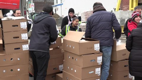 Toronto, Ontario, Canada December 2018 Volunteers hand out free food and turkeys to people at Christmas in Toronto