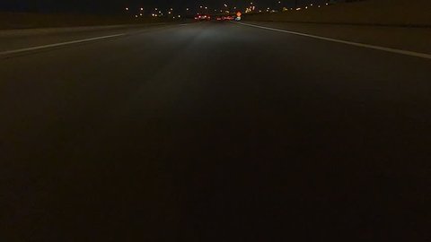 Toronto, Ontario, Canada December 2018 Driving plate car traffic POV on highway at night in on dark highway
