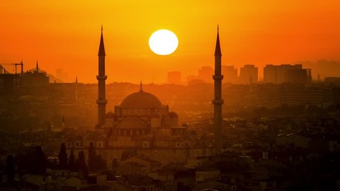 Sunset time lapse in Istanbul Turkey. Silhouette of Fatih Mosque. 