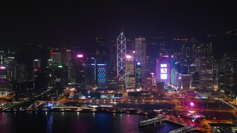 night time illuminated hong kong city downtown traffic bay aerial panorama 4k