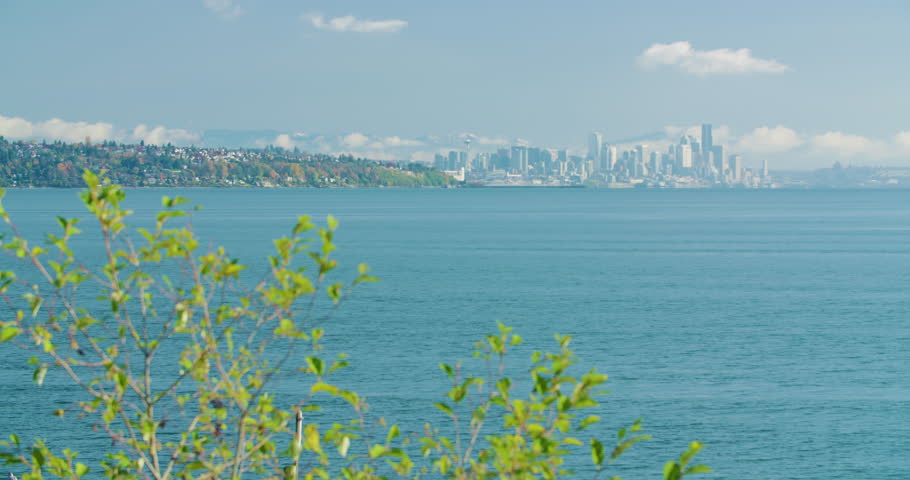 View of Seattle Washington City Skyline From Far Away Across Puget Sound Sunny Autumn Day