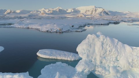Antarctica Polar Iceberg Coast Aerial Drone View. Snow Covered Arctic Ocean Shore Landscape Panoramic Overview. North Nature Seascape Copter Footage Shot in 4K (UHD)