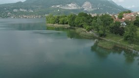 Aerial Drone Footage View Of Pusiano’s lakes, Alps lake, Italy Europe Alps, water, park // no video editing
