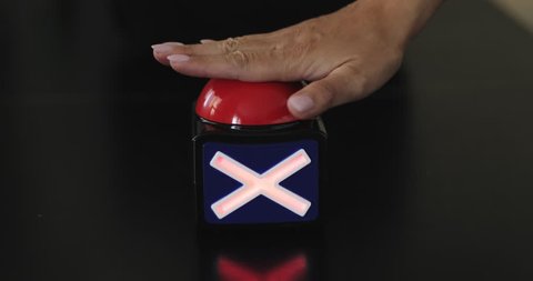 Female hand presses the stop button many times. Big red button with stop inscription being pushed. 