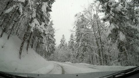 Car being driven on a snowy road
