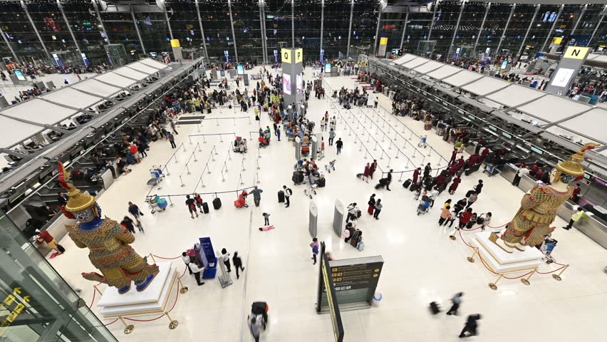 4K Time lapse of people and passenger waiting in the queue for checking at Suvarnabhumi Airport