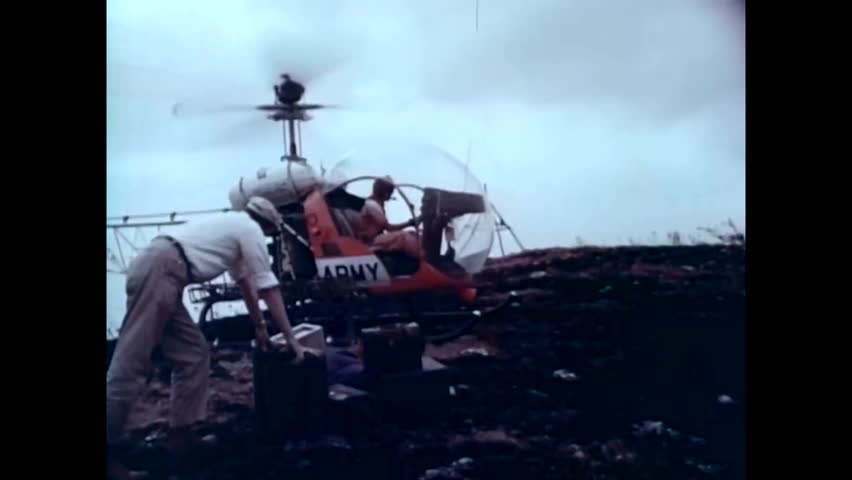 CIRCA 1960s - US Army surveyors uses planes and helicopters to get to hard to reach areas in the 1960s - | Shutterstock HD Video #1021266511