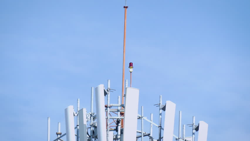 (2in1)Telecommunication (5G.,4G) tower mast on sky background.Cellular telephone network.Digital wireless connection system.Receiving station.Antenna.Communication.High technology.4K Royalty-Free Stock Footage #1021270408
