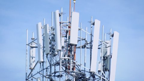 (2in1)Telecommunication (5G.,4G) tower mast on sky background.Cellular telephone network.Digital wireless connection system.Receiving station.Antenna.Communication.High technology.4K