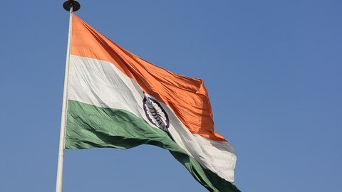 Indian National Flag, the tricolor fluttering and unfurling in the Central Park at Connaught Place. It is the largest Indian flag on public display in Delhi, India