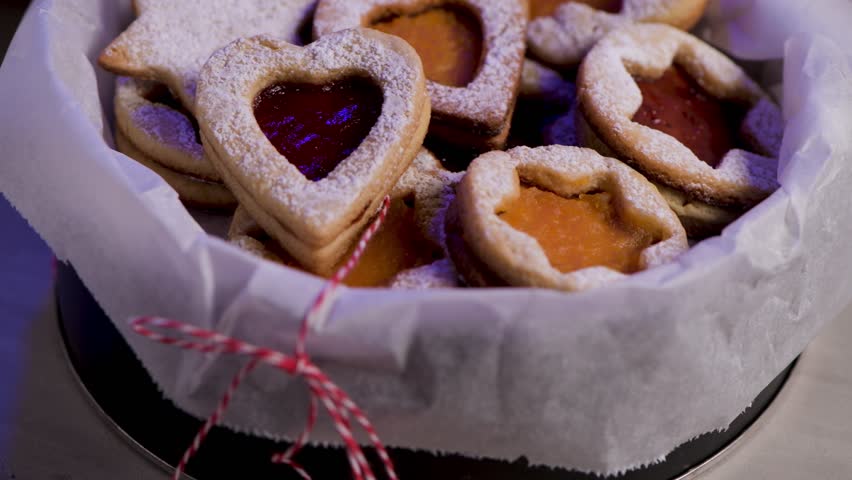 Homebaked Christmas Cookies With fruit Jam filling and Icing Sugar.