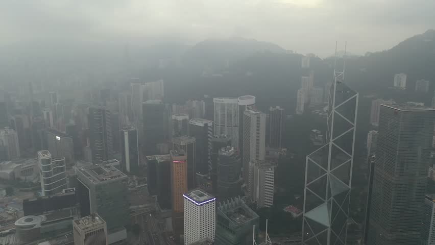 Central, Hong Kong - December 20, 2018 : Aerial view of Hong Kong Skyline in misty sunrise. | Shutterstock HD Video #1021287907