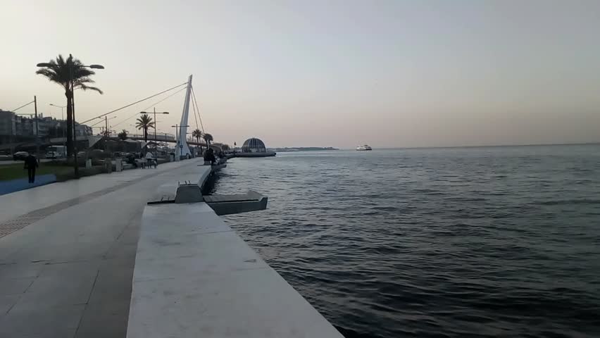 A panoramic view from the seaside path at Goztepe - Izmir (Turkey) - at sunset time in a mild november day - Video clip