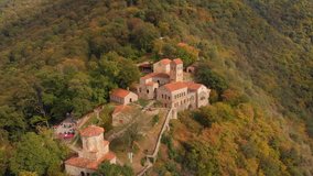 Dramatic. aerial view of the historic Nekresi Monastery. an important cultural site on a hilltop in the Gruzian countryside. 4k Ultra HD video