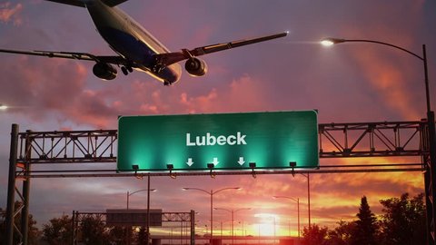 Airplane Landing Lubeck during a wonderful sunrise