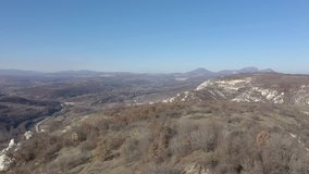 Panning on landscape with Deli Jovan Krsh and Stol mountains in distance 4K drone video