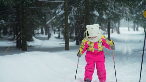 Little Girl Trying to Skiing