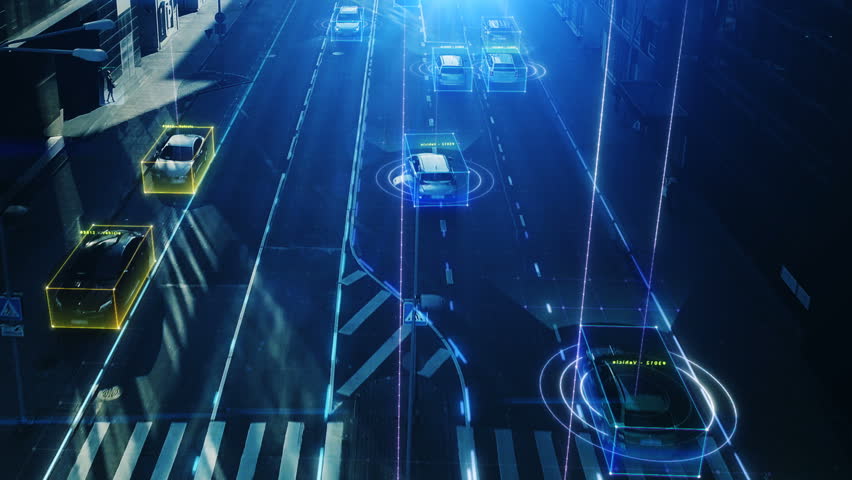 Aerial Drone Shot: Autonomous Self Driving Cars Moving Through City. Concept: Artificial Intelligence Scans Cars and Pedestrians, Following Movement and Showing Data. Royalty-Free Stock Footage #1021307839