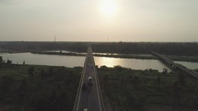 Silhouette aerial footage of two bridge with traffic in countryside