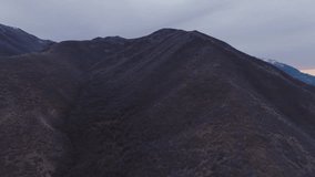 drone tracking left along a mountain