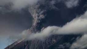 Timelapse of the Fuego Volcano erupting heavily, shooting pyroclastic material into the sky and covering its surrounding area in ash. - Powered by Shutterstock - Get 15% off with code: PIKWIZARD15