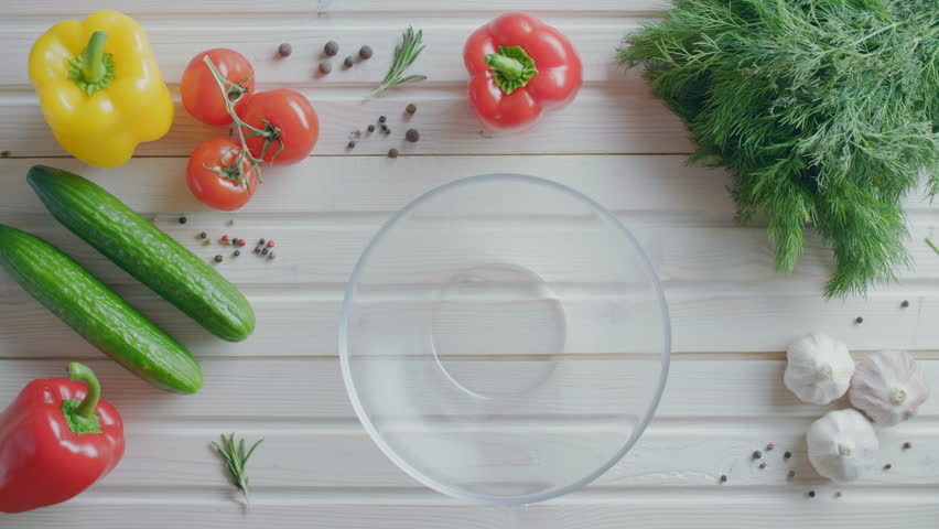 Preparation of vegetable salad in a salad bowl, flat lay Royalty-Free Stock Footage #1021335946
