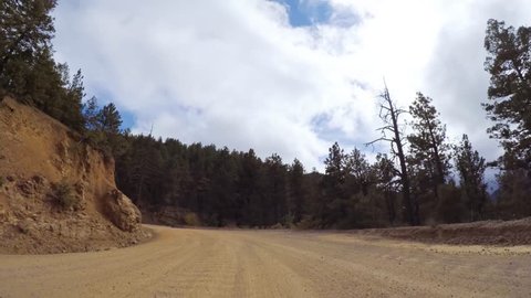 Driving on small mountain dirt roads from Colorado Springs to Cripple Creek in Autumn.