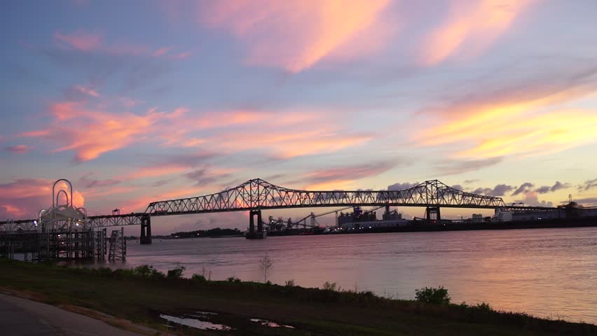 Sunset over baton rouge bridge and Mississippi river from the levee