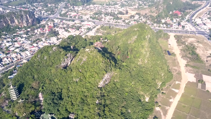 fantastic bird eye panorama buddhist temple buildings with pagoda on forestry high hill among large city