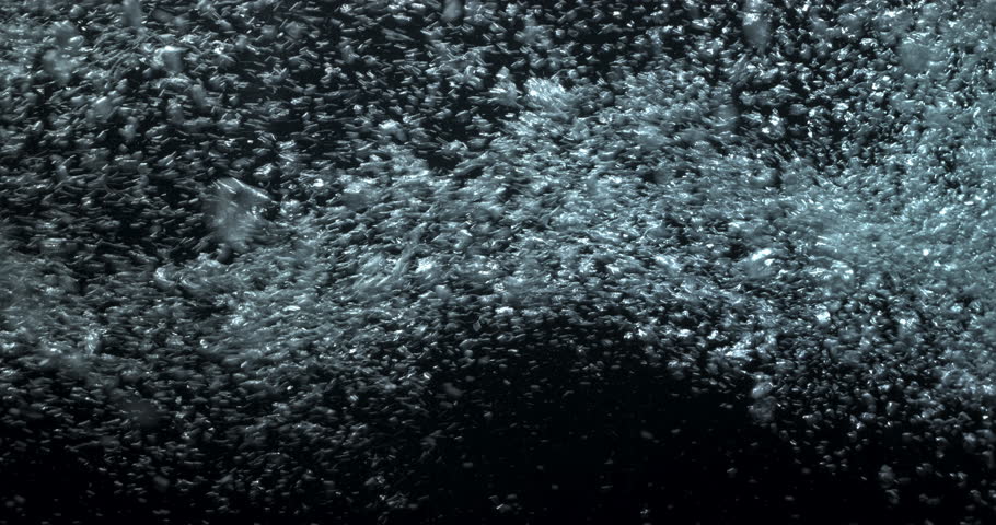 4K underwater illuminated bubbles motion. Ocean floor bubbles. Real underwater footage. Deep under sea level.  Floating plankton. Marine background VFX element. Underwater bubbles mayhem
