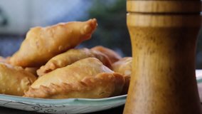 Malaysian desert pastry curry puff or locally known as 'karipap' on wooden table.