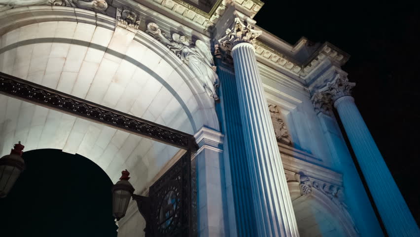 Night-time slow panning shot of the 19th century Marble Arch in central London, England, UK