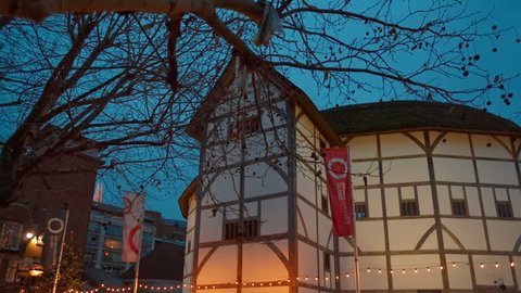 LONDON, circa 2018 - Slow panning shot of Shakespeare Globe medieval theater in London, England, UK during early evening