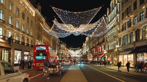 LONDON, circa 2018 - POV shot along Regent Street in Central London, England, UK beautifully decorated with Christmas Lights