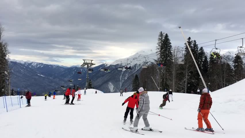 people ride on the mountain. ski resort. chair lift