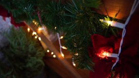Closeup video of green and red Christmas decorations hanging at wooden porch. Holiday background  - Powered by Shutterstock - Get 15% off with code: PIKWIZARD15