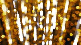 Beautiful shiny holiday background. Bokeh of defocused lights of street Christmas garland. Real time full hd video footage.