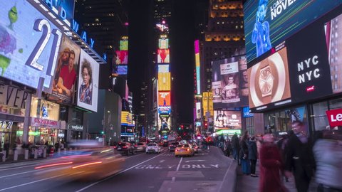 NEW YORK CITY, USA - NOVEMBER 20, 2018: Cars Traffic and People Crowd at Times Square at Night. Vertical Panoramic Time Lapse