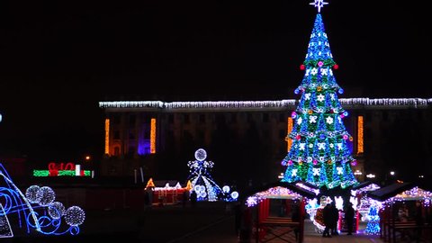 Panoramic view on amazing colorful New Year decorations shining bright at Christmas market main tree fair