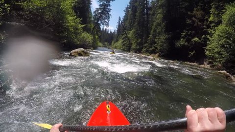 Whitewater kayaking on the Rogue River in Southern Oregon. Unique POV