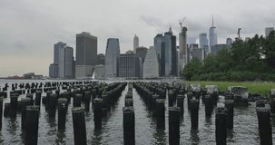 View of Manhattan skyline from a pier. Zoom in video of Manhattan buildings.
