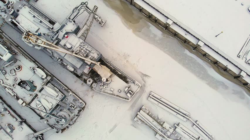Frozen river port, winter, aerial survey, top view 4k