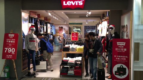 BANGKOK - DECEMBER 8, 2018: People at a Levi's store in the Don Mueang Airport. Levi Strauss and Co. is a privately owned American clothing company known worldwide for its Levis brand of denim jeans