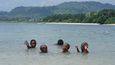 Vanimo, Papua New Guinea - 05 19 2017: Slow Motion Kids Laughing And Waving At Camera At Beach In Vanimo Papua New Guinea