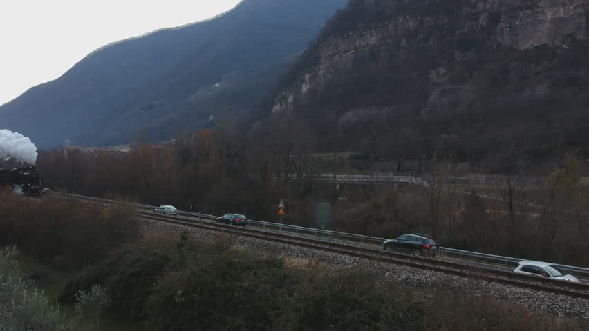 Historic steam train rolling through the valley