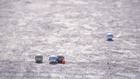 Petanque sport, player throw ball to point ball in competition 